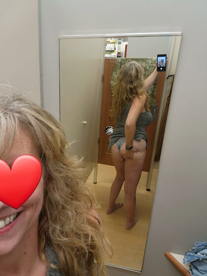 Having some fun in the changing room trying on new outfits.