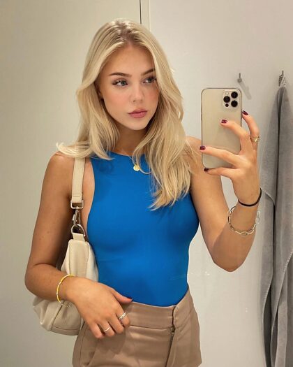 blonde in blue top