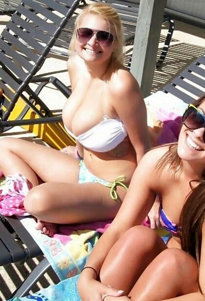 The boobs part out of the bikini is already bigger than her friend's boobs