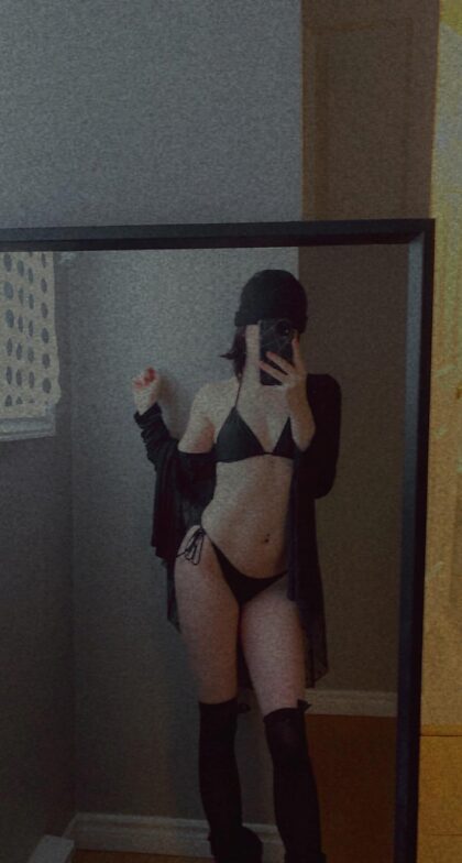 little black bikini paired with some black over the knee socks 