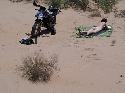 Ride and read in the sand