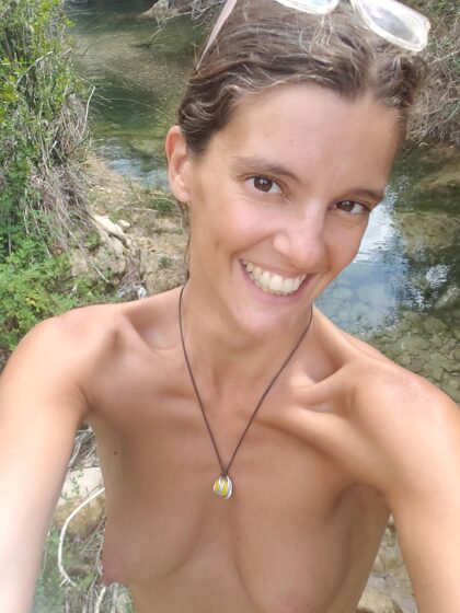 Enjoying the river. Describe this pic in 3 words. Mine : joy, boobs, river