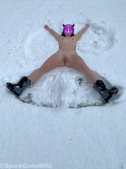 Making a snow angel in the park