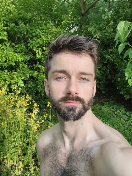 hairy pic of me with backyard flowers 
