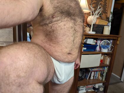 Daddy bear showing off his tighty whities. I'd love to get a couple of them. Young horny guys to service me