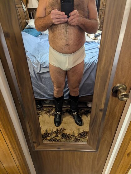 Daddy bear showing off his tighty whities. I'd love to get a couple of them. Young horny guys to service me