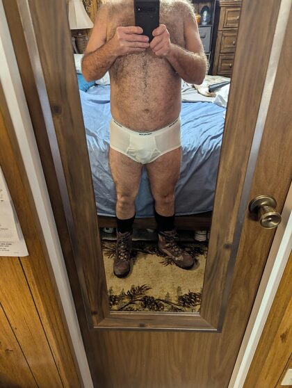 Daddy bear showing off his tighty whities. I'd love to get a couple of them. Young horny guys to service me