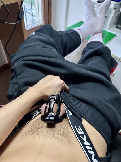 Twink locked wearing a jockstrap and Nike socks