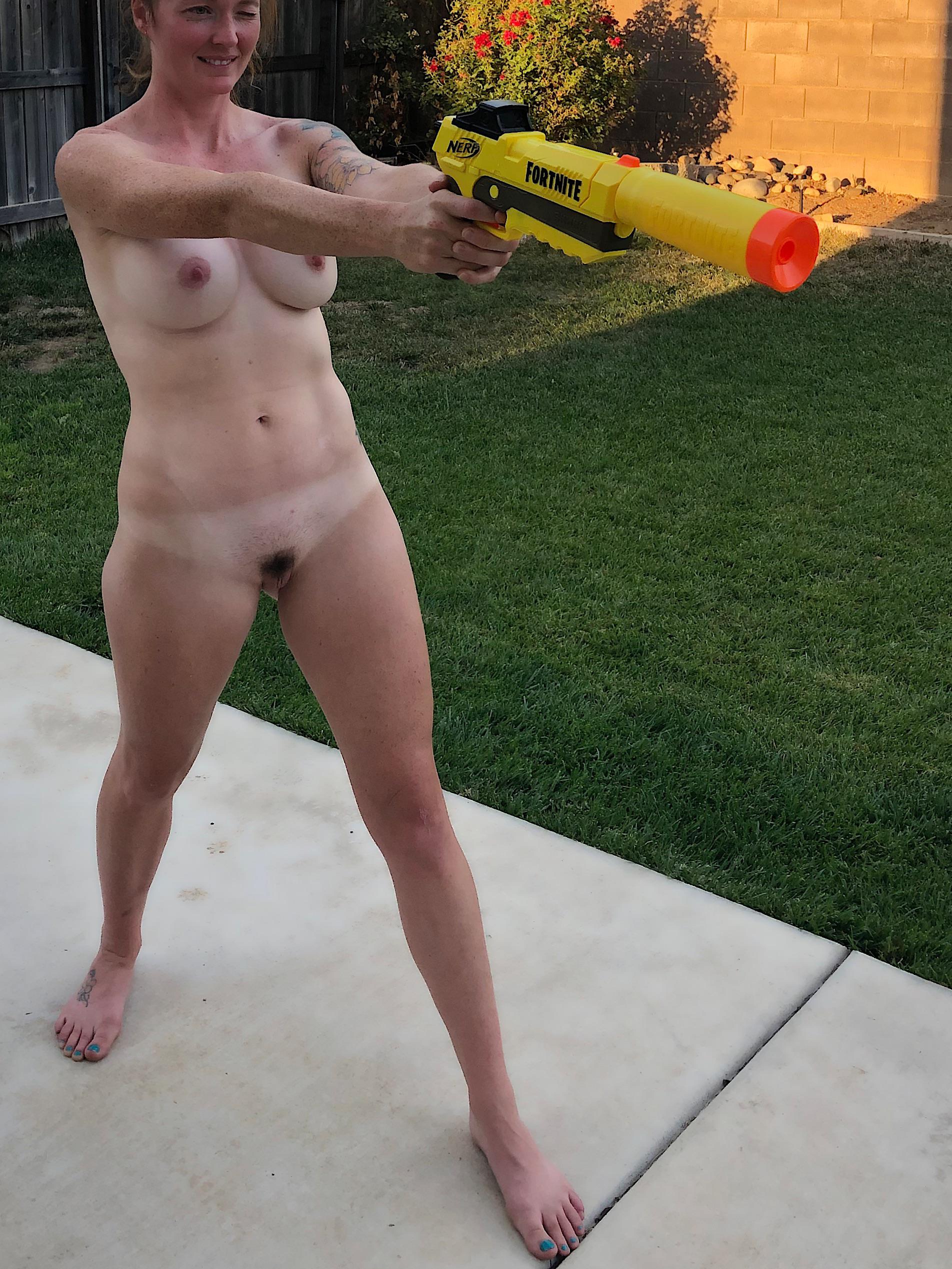 Naked Nerf dart fights in the backyard