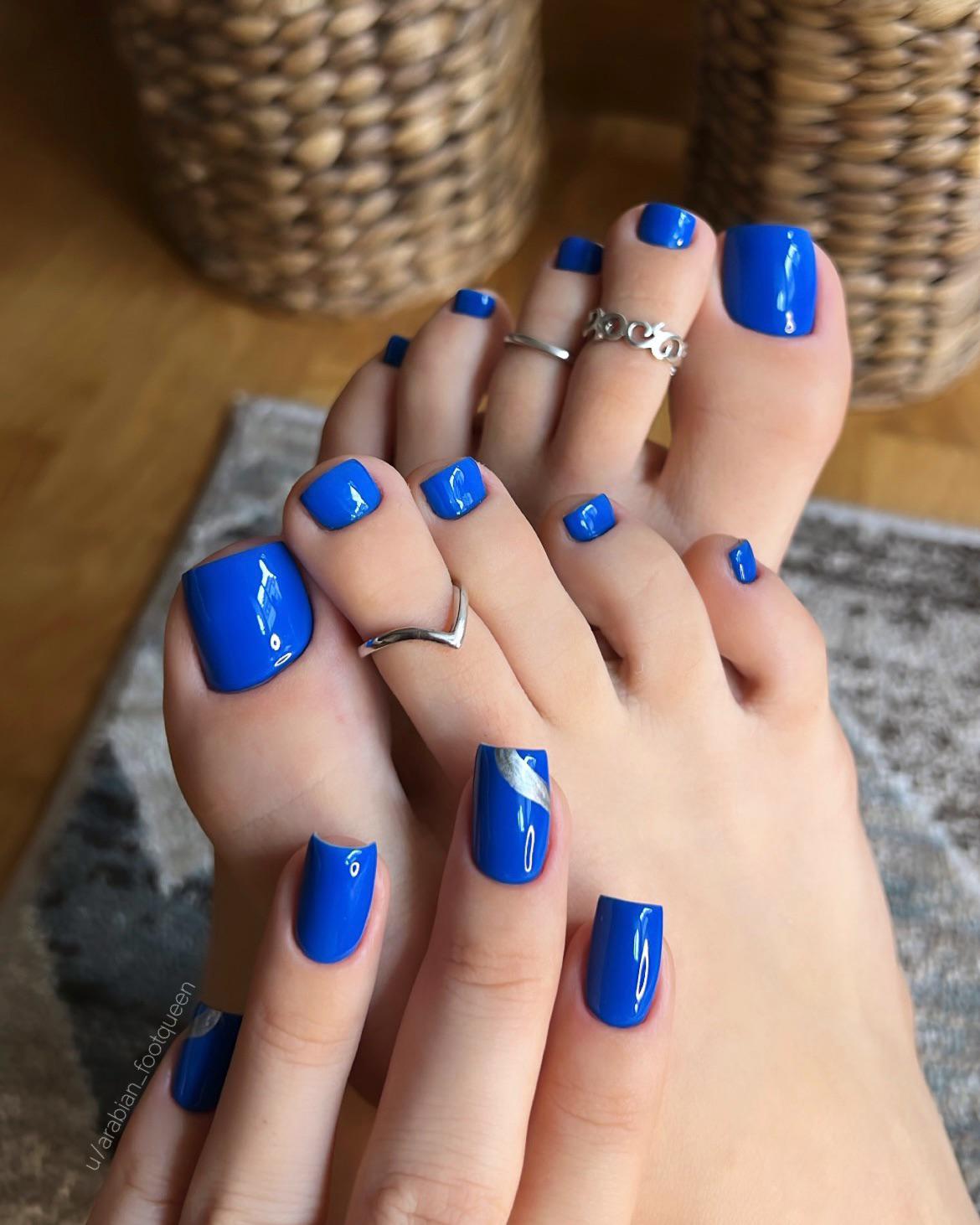 Blue pedicure and toe rings